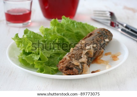 fish with salad and wine