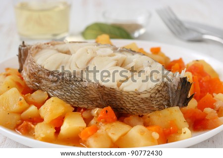 boiled fish and vegetables with glass of wine