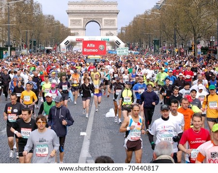 PARIS, FRANCE - APRIL 6: Group of runners start on Champs Elysees  the Paris Marathon, April 6, 2008 in Paris, France