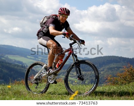 VSETIN, CZECH REPUBLIC - SEPTEMBER 9: Unidentified biker climbs the hill above town of Vsetin in Wallachian 50 Mountain Bike Race, September 9, 2006 in Vsetin, Czech republic.