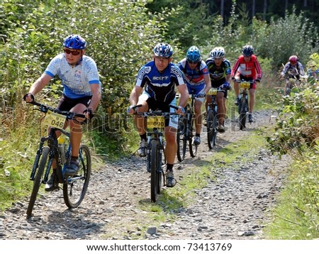VSETIN, CZECH REPUBLIC - SEPTEMBER 9: Group of bikers climbs the hill above town of Vsetin in Wallachian 50 Mountain Bike Race, September 9, 2006 in Vsetin, Czech republic.