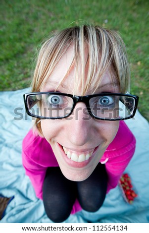 Wide angle shot from above of young woman with glasses