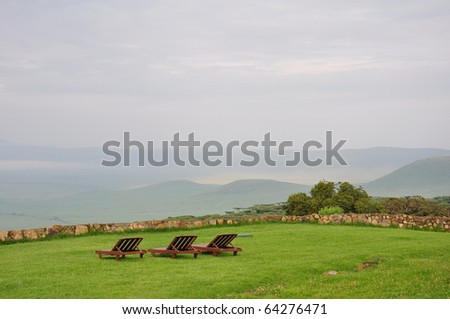 Wooden lawn chairs overlooking Ngorogoro Crater in Tanzania