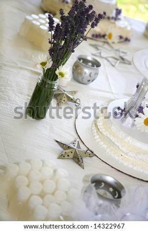 stock photo Homemade Wedding Cake with Fresh Daisies and Lavender