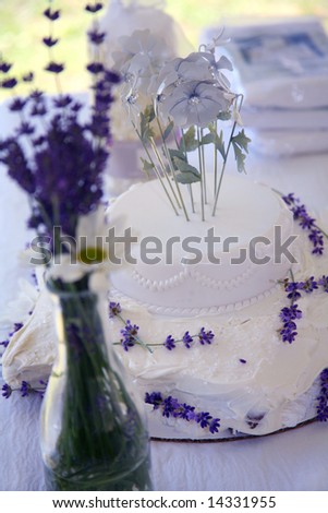 stock photo Homemade Wedding Cake with Fresh Daisies and Lavender