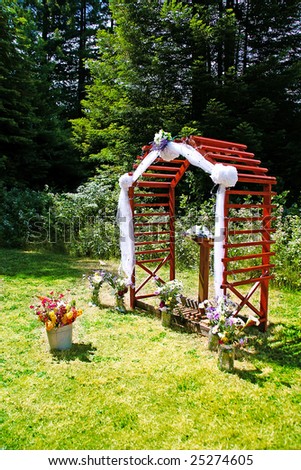 stock photo Outdoor Wedding Ceremony with Redwood Arch