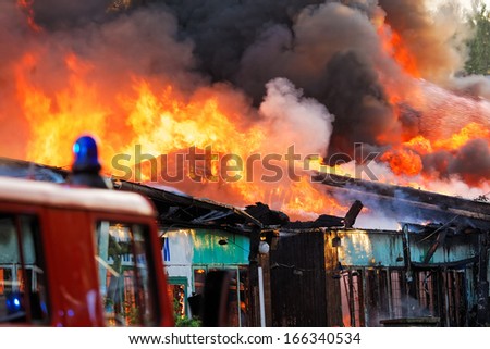 Burning ruins of building in city
