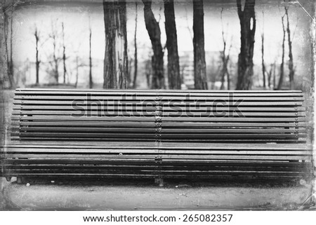 Long bench in the rainy Park