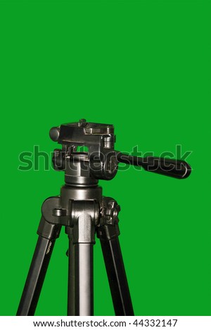 A carbon fiber tripod isolated on green background