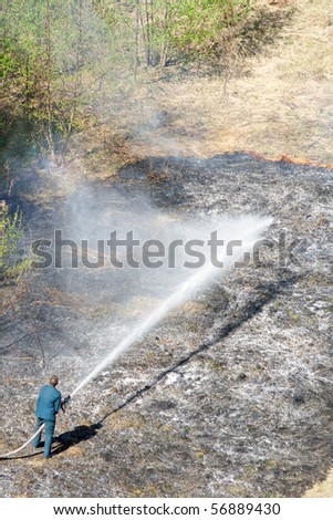 One man extinguishing fire