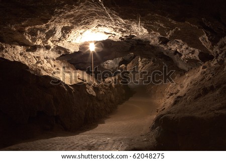 A dark cave with a pathway in the city of Kungur, Russia