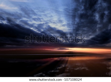 Dramatic sunset with rays streaming through the clouds