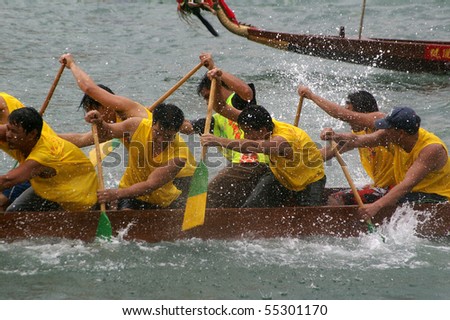 TUEN MUN, HONG KONG -  JUNE 16: Participants paddle their boat during a dragon boat race on June 16, 2010 in Tuen Mun, Hong Kong