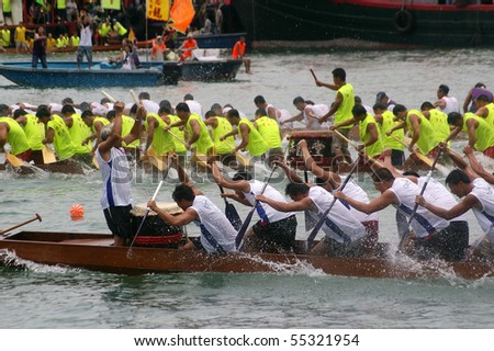 TUEN MUN, HONG KONG - JUNE 16: Participants paddle their boats during a dragon boat race on June 16, 2010 in Tuen Mun, Hong Kong