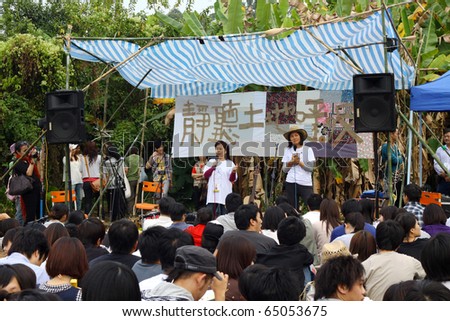 HONG KONG - NOV 14: A breath concert in Ma Shi Po to let the public know more about this village, a band plays music on Nov 14, 2010 in Hong Kong. A band appears in the open air with many audiences.