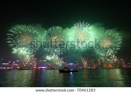 HONG KONG - FEB 4: Chinese New Year Fireworks at Victoria Harbour, Hong Kong on 4 February, 2011. This is the year of rabbit and the fireworks lasts for around 25 minutes. It shows different colors.
