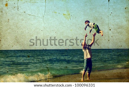 Happy father and son on the beach