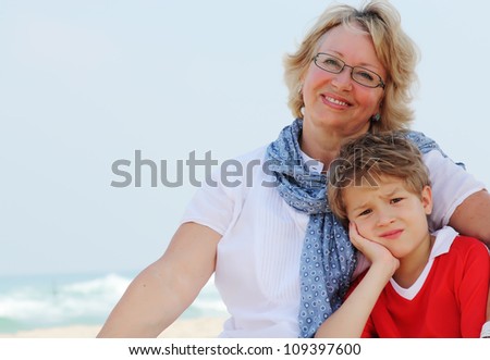 happy grandma and grandson on vacation at sea