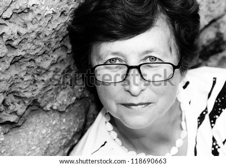 Portrait of 60-years-old beautiful woman outdoors
