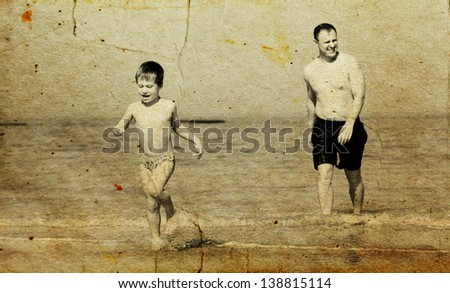 father and son going to swim in the sea. Photo in old image style.