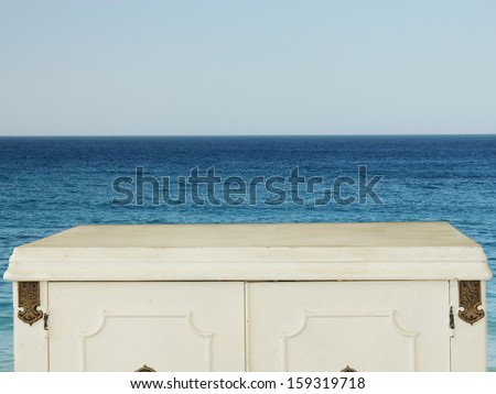 blue sea and sky with wooden vintage table background