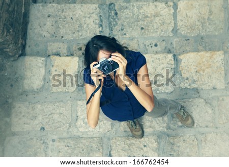woman with old camera outdoors
