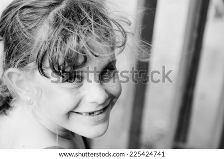 outdoors portrait of freckled cute girl