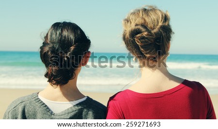 two best friends walking at seaside
