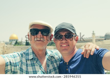 Selfie portrait of father and adult son