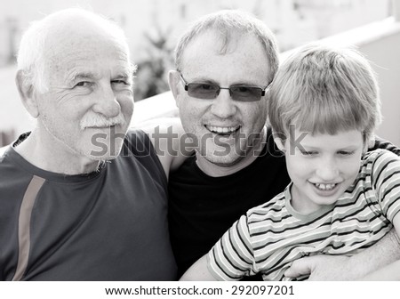 grandfather with adult son and grandchild
