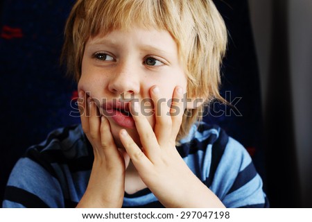 Cute 7 years old boy traveling in the train