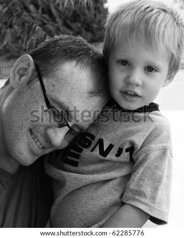 Dad hugging his son, black and white picture