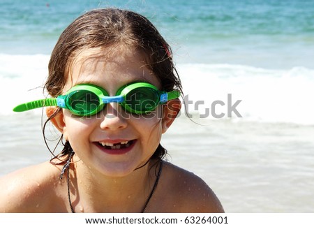 beautiful, funny, girl seven years at sea. There is no front teeth. wearing glasses for swimming
