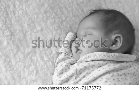 monthly child lies on a white blanket