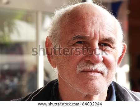 handsome elderly man in the street. portrait