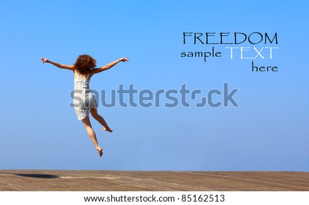 funny jump of young woman. freedom.