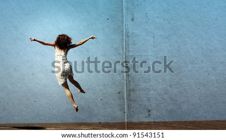 funny jump of young woman. freedom. Photo in old image style.