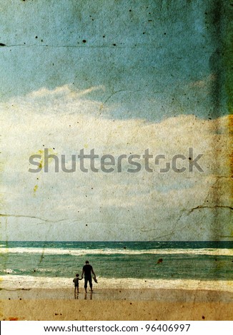 father and son playing together on the beach. Photo in old image style.