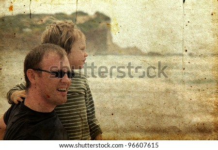 father and son on the beach. Photo in old image style.