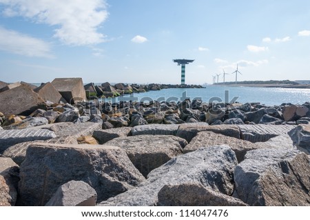 Boulders and concrete block dam near Maasvlakte 2, the port of Rotterdam\'s land reclamation project. The concrete cubes weigh over 40 tonnes a piece and measure 2.5 by 2.5 by 2.5 m.