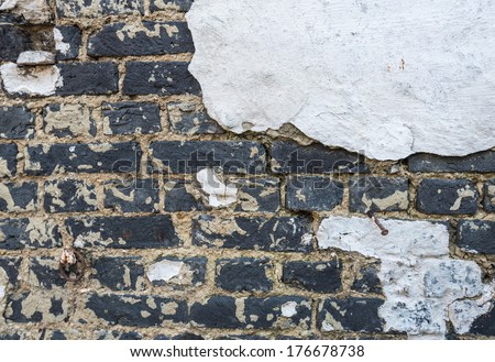 Detailed image of an old original white plastered brick wall of an old brick factory in Belgium