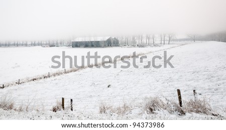 It is very early in the morning and it freezes very much in the Netherlands. The morning mist still hangs partially over the landscape. The view is very limited and less colorful.