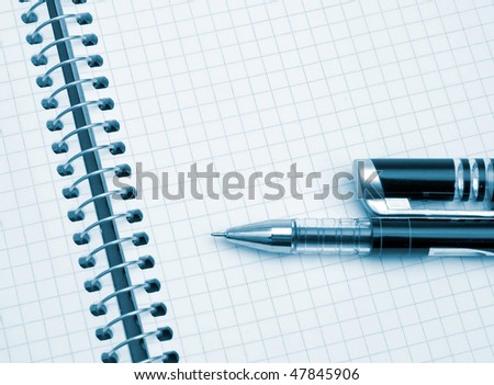The image of the page of notebook and pen