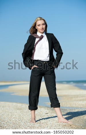 Concept illustrating the discovery of rich capabilities of the business woman on the beach