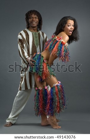 Beautiful girl and lad in african dance suit