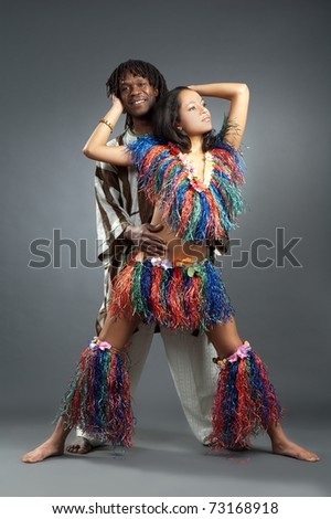 Beautiful girl and lad in african dance suit