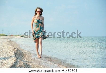 Beautiful sexual girl blonde pose on beach