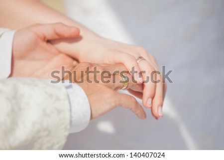 Married couple holding their hands
