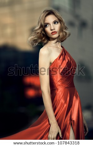 Sexy Young Beauty Woman In Fluttering Red Dress