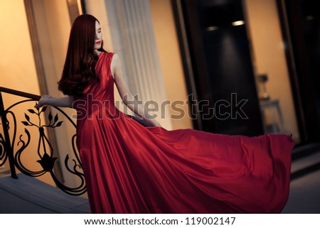 Young Beauty Famous Woman In Red Dress Outdoor